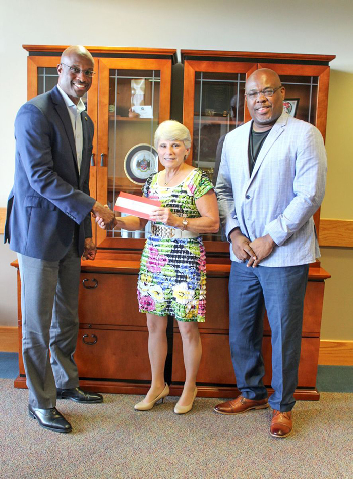 Alabama Power executives Terry Smiley, left, and Spencer Williams, right, presented a $50,000 check to Dr. Kathy Murphy, president of Gadsden State.