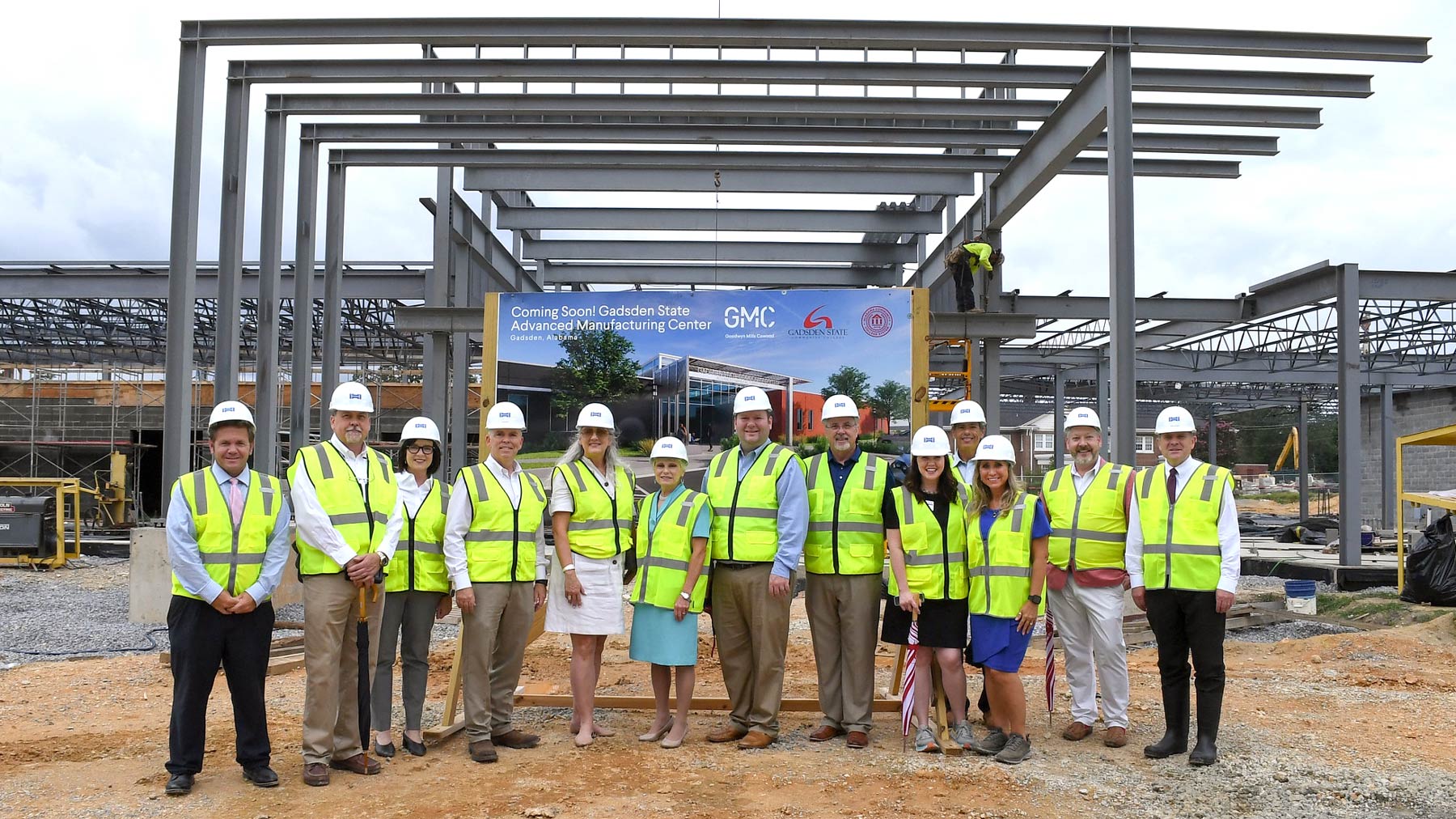 Dr. Murphy, members of the executive cabinet and local dignitaries in front of the worksite for the Advanced Manufacturing Center on the East Broad Campus