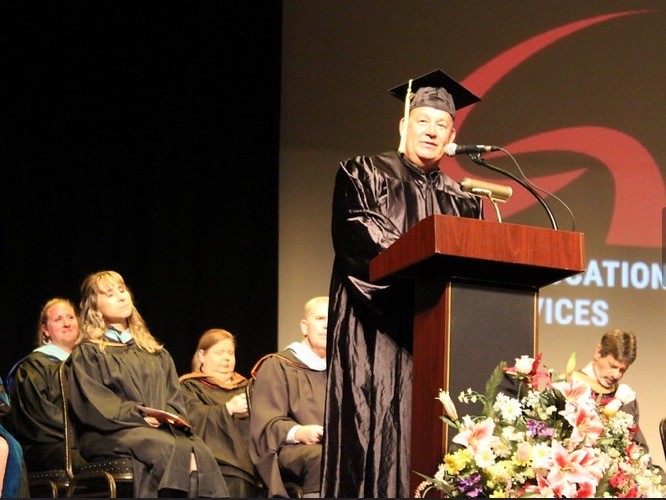 Tracy Hutcheson speaks at an Adult Education Graduation, where he received his high school diploma.