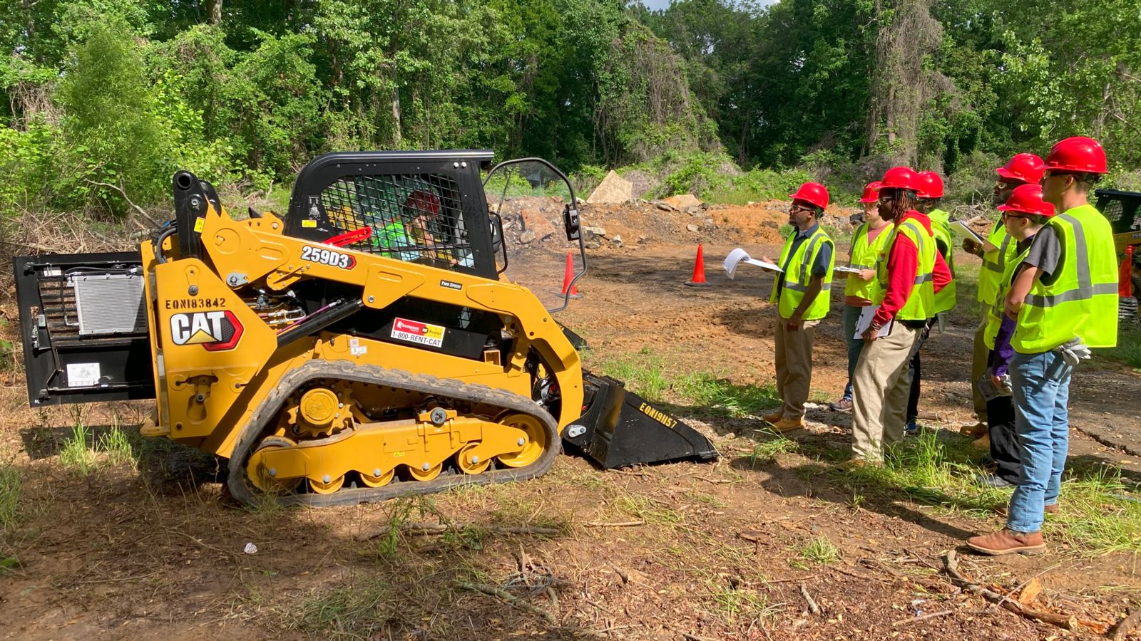 Students in the skid steer training at Gadsden State Community College observe the operation of the piece of equipment used primarily for digging. The free training program is through Alabama Community College System’s Skills for Success.